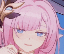 a close up of a girl with pink hair and blue eyes .