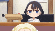 a girl with blue eyes is looking at another girl