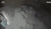 a hulu advertisement with a drawing of a face on a pile of snow