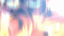 a blurry picture of a pink and blue background with a rainbow of colors