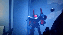 a robot with red lights on its eyes is standing in the dark