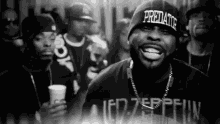 a man wearing a beanie that says predator