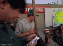 Allen Moreno Thumbs Up GIF - Allen Moreno Thumbs Up Looking At Phone GIFs