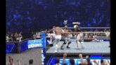 a wrestling match is going on in front of a smack down banner
