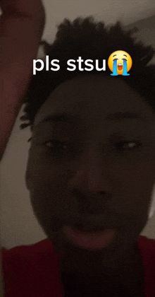 a close up of a person 's face with the words pls stsu written on it