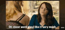 a woman is sitting at a table talking to another woman and says oh clever word play i like it very much .