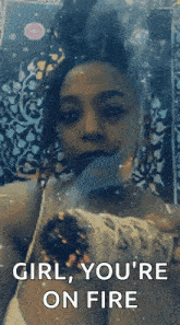 a woman is smoking a hookah and says `` girl , you 're on fire ''