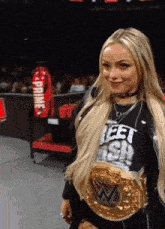 a blonde woman wearing a black shirt that says prime on it