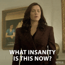 a woman with her eyes closed says " what insanity is this now "