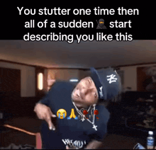 a man wearing a ny hat is pointing at something in a room with the caption you stutter one time then all of a sudden