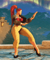 a woman with red hair is dancing in front of a mountain