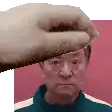 a pixel art of a hand holding a man 's head in front of a pink background .