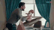 Picking Up Baby Waking Up GIF - Picking Up Baby Waking Up Baby GIFs
