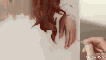 a painting of a woman 's hand with the words made in animotica below it