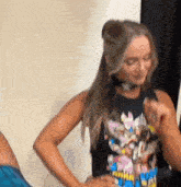 a woman wearing a t-shirt that says ' a ' on it