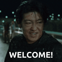 a man with blood on his face and the words welcome