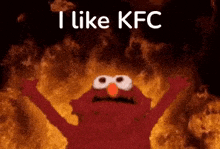 elmo from sesame street is standing in front of a fire with his arms outstretched .