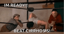a man is doing push ups in a wrestling ring .