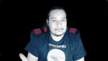 a man wearing a t-shirt that says wasowned on it