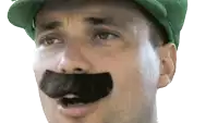 a man wearing a green hat with a fake mustache on his face