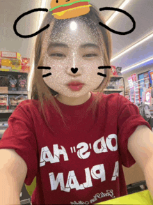a woman wearing a red shirt that says ah " 2 " go maja