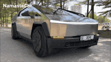 a silver car with a license plate that says 3b240
