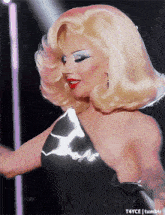 a woman with blonde hair and red lips is on a tumblr page