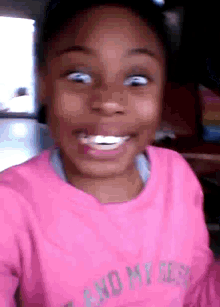 a girl wearing a pink shirt that says " and my girl "