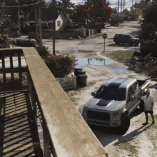 a white truck is parked on the side of the road