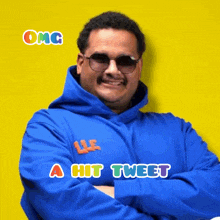 a man wearing sunglasses and a blue hoodie with the words " omg a hit tweet " above him