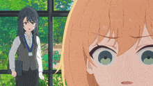 a woman with a lanyard around her neck is standing next to a girl with green eyes