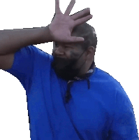 a man wearing a blue shirt and a mask covering his face