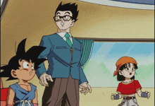 a man with glasses stands next to two children