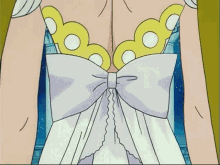 a close up of a woman 's back with a white bow
