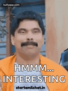 a man with a mustache is wearing an orange jacket and says hmm ... interesting
