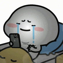 a cartoon character is crying while holding an apple phone