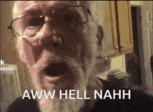 a man with a beard and glasses is screaming and says aww hell nahh .