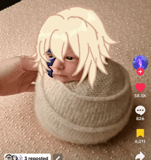 a picture of a baby wrapped in a knitted hat with a person holding it