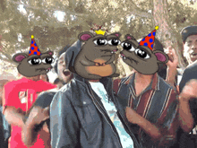 a group of people wearing party hats with cartoon rat faces on them