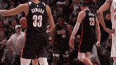 a basketball player with the number 33 on the back of his shirt