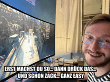 a man wearing glasses is smiling in front of a computer monitor that says erst machst du so