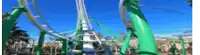 a roller coaster at an amusement park on a sunny day