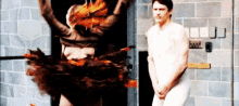 a naked man is standing in front of a naked woman in a costume .