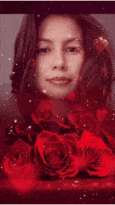 a man is surrounded by red roses and a mirror
