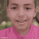 a close up of a child 's face with the name emishaday on the bottom right