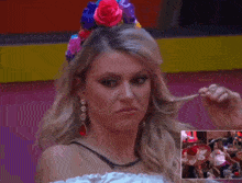 a woman with a flower crown on her head is making a funny face