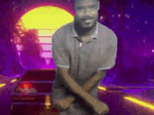 a man is dancing in front of a purple background