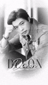 a black and white photo of a young man with the name devon