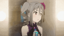a girl in a purple dress is holding a bottle that says h2o
