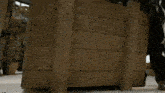 a man with curly hair is laying on a wooden floor